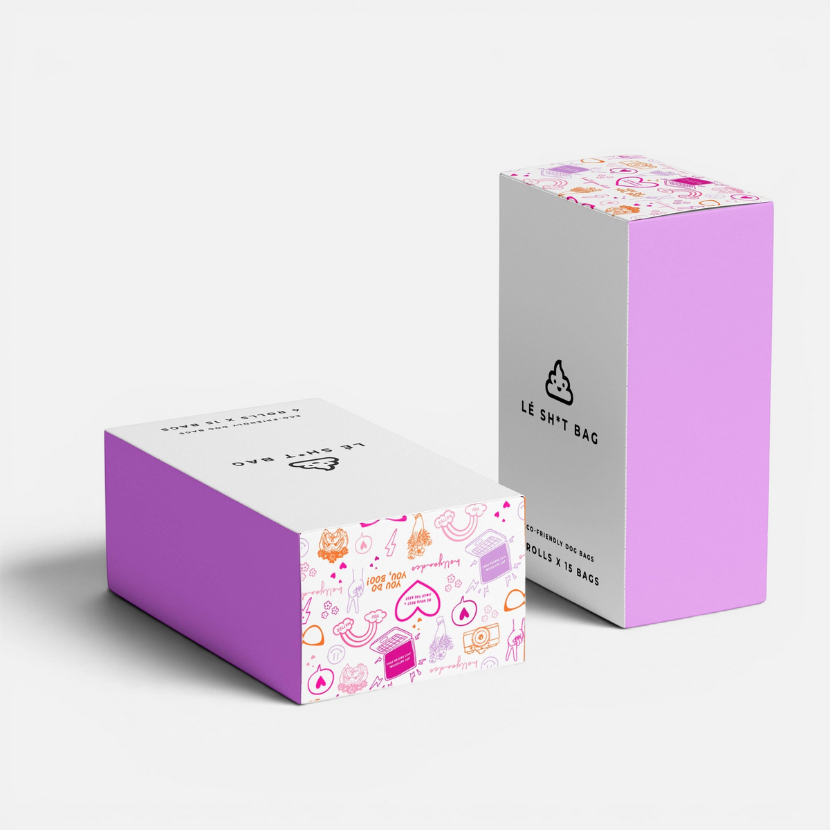 The Dog Emporium Lé Sh*t Bag compostable dog waste bag boxes featuring a playful pink and white doodle pattern.