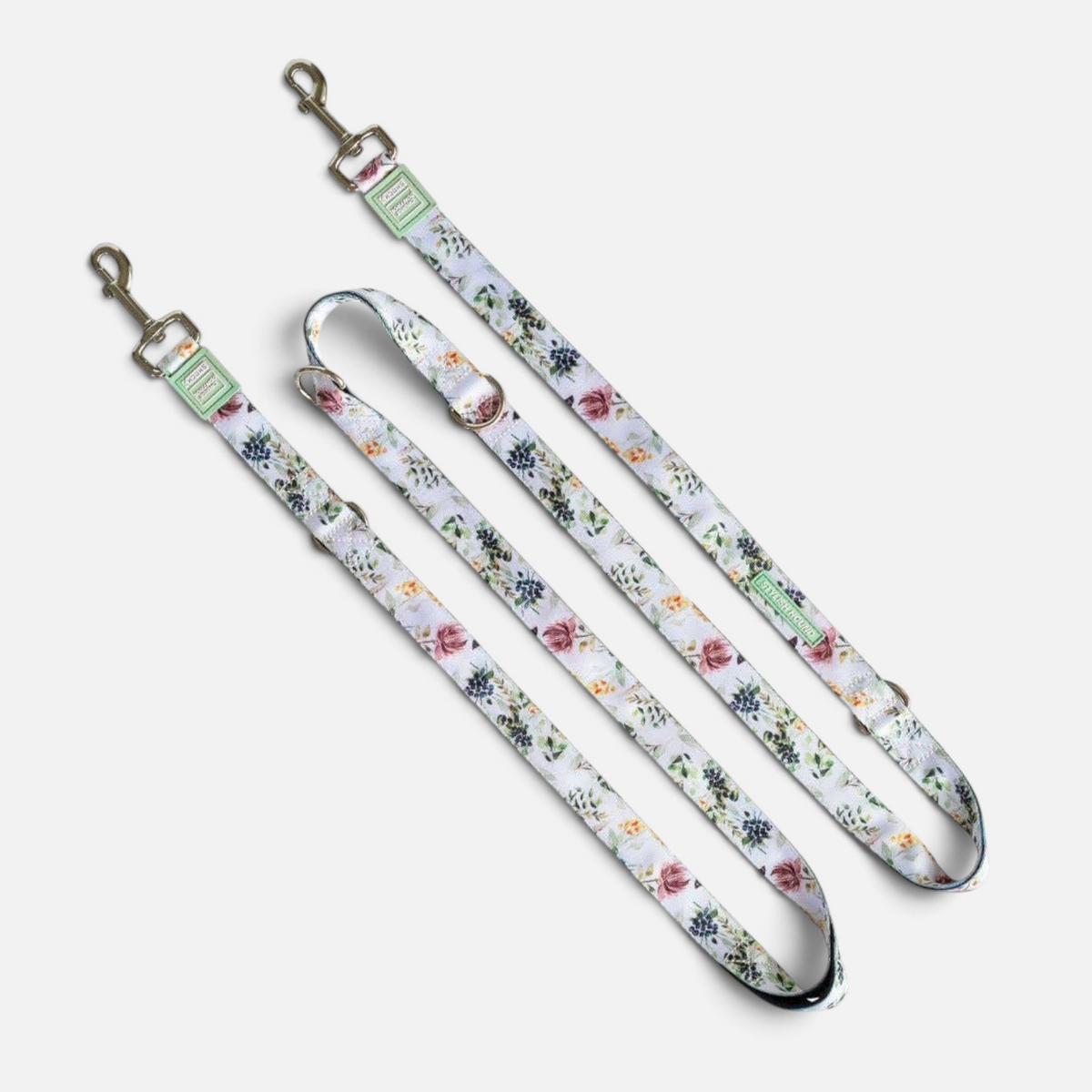 The Dog Emporium Evergreen multi-function dog leash featuring a floral print on recycled material with metal hardware.