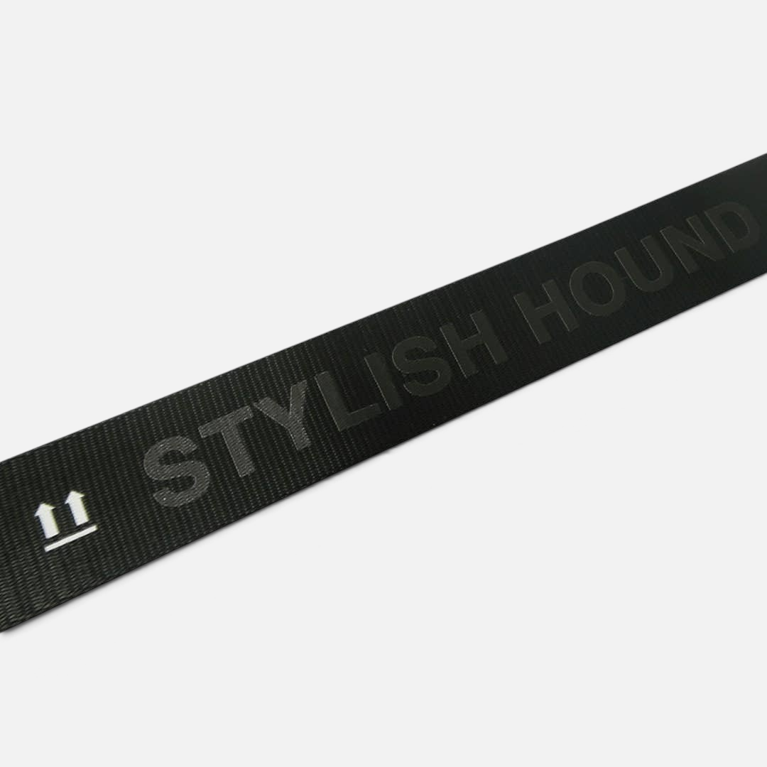 The Dog Emporium black adjustable bag strap featuring the Stylish Hound logo and icon in white text.