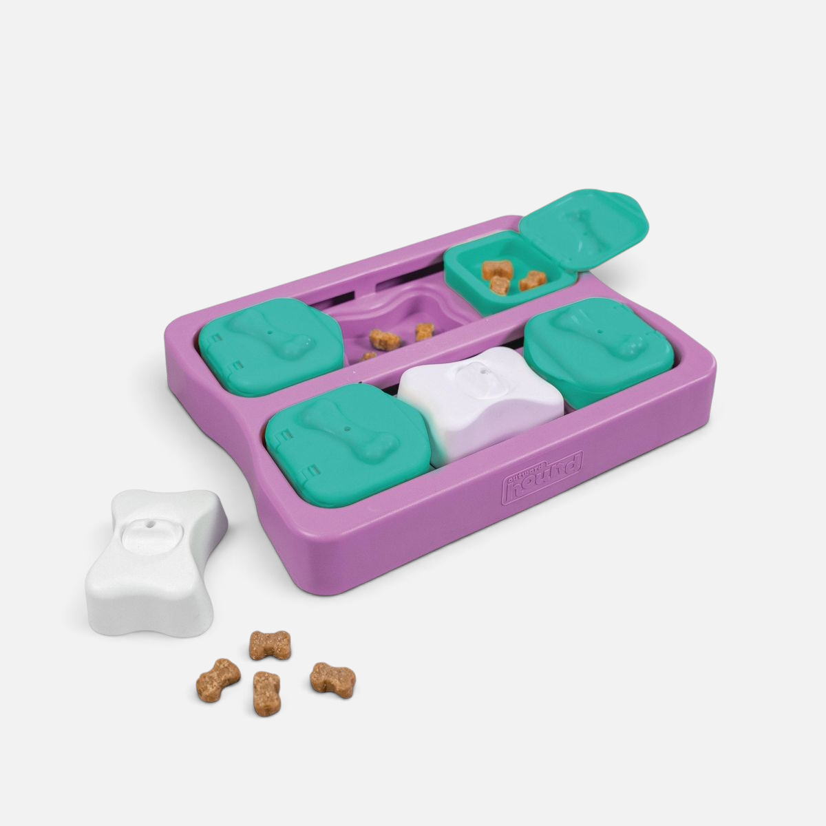 The Dog Emporium Outward Hound Nina Ottosson Dog Brick interactive puzzle toy with treat compartments in purple and teal