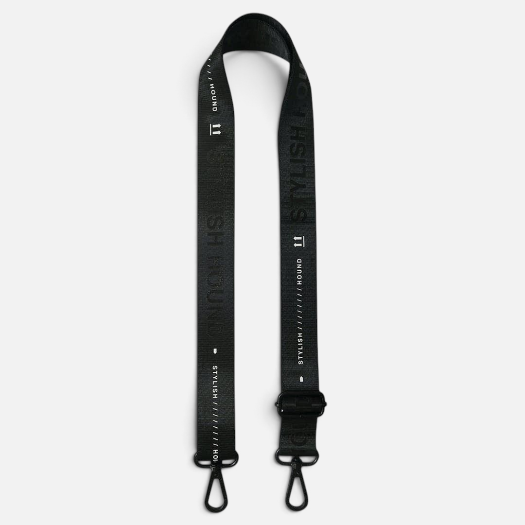 The Dog Emporium black adjustable crossbody bag strap with white logo branding and durable black hardware clips